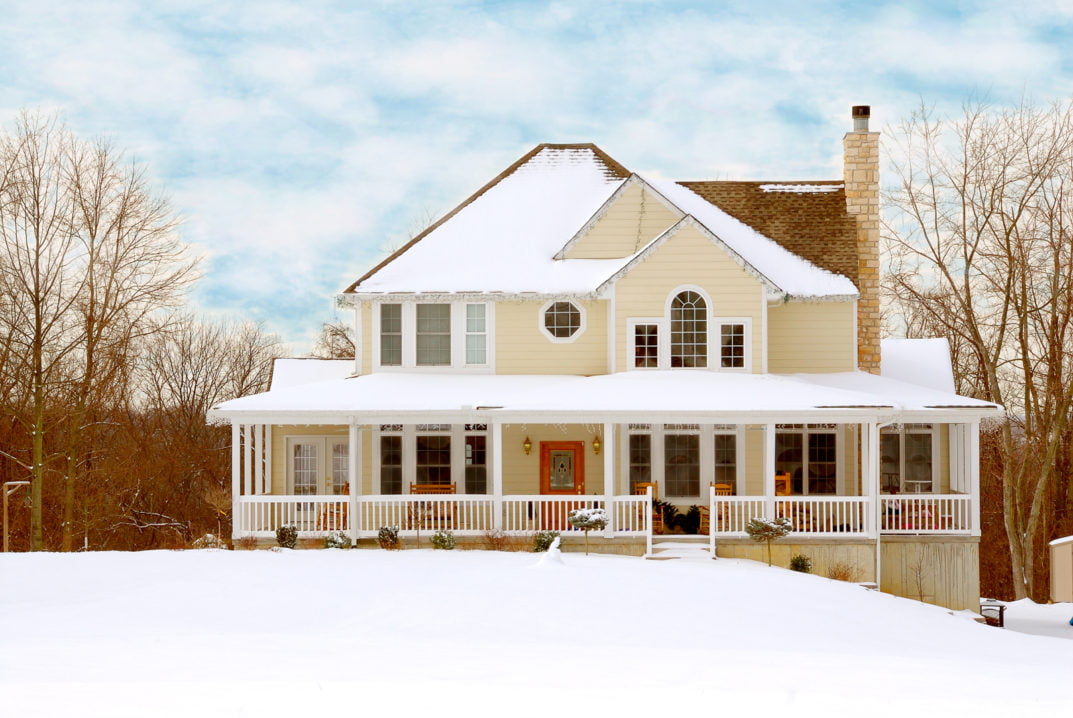 Home in winter with snow