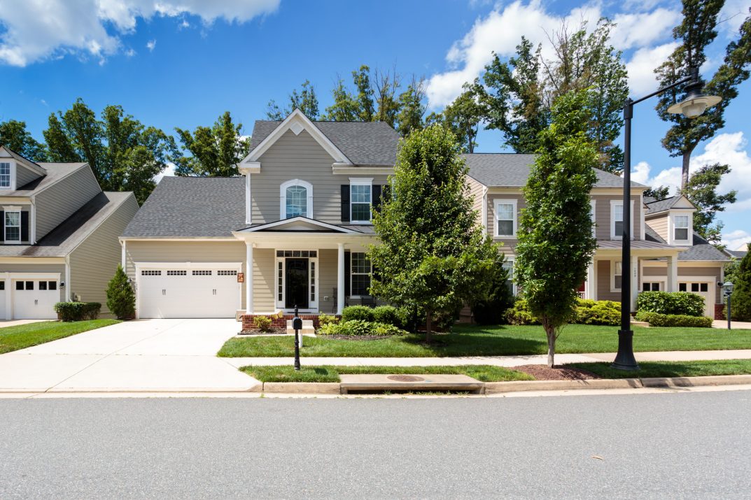 Exterior view of a Fredericksburg VA home for sale, featuring a welcoming façade, mature landscaping, and classic Virginia curb appeal.